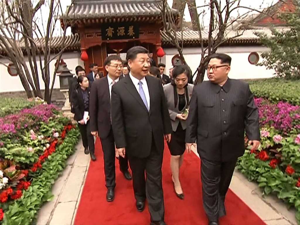 استقبلت بكين بحفاوة كبيرة الزعيم الكوري الشمالي كيم جونغ أون (أ ف ب)