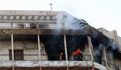 حريق في مبنى خلال الأيام الأولى للأحداث (أرشيف ــ بلال جاويش)