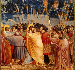 لوحة من القرن الرابع عشر للرسام الايطالي جيوتو تصور خيانة يهوذا ليسوع المسيح