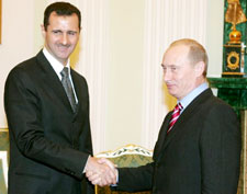 بوتين و الأسد في مبنى الكرملين في موسكو أمس (رويترز)