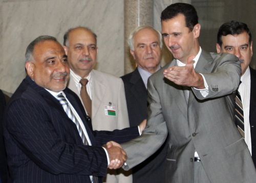 الأسد وعبد المهدي في قصر الشعب في دمشق أول من أمس (لؤي بشارة - أ ف ب)